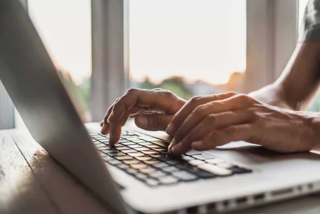 An employee is using Office 365 on a laptop.